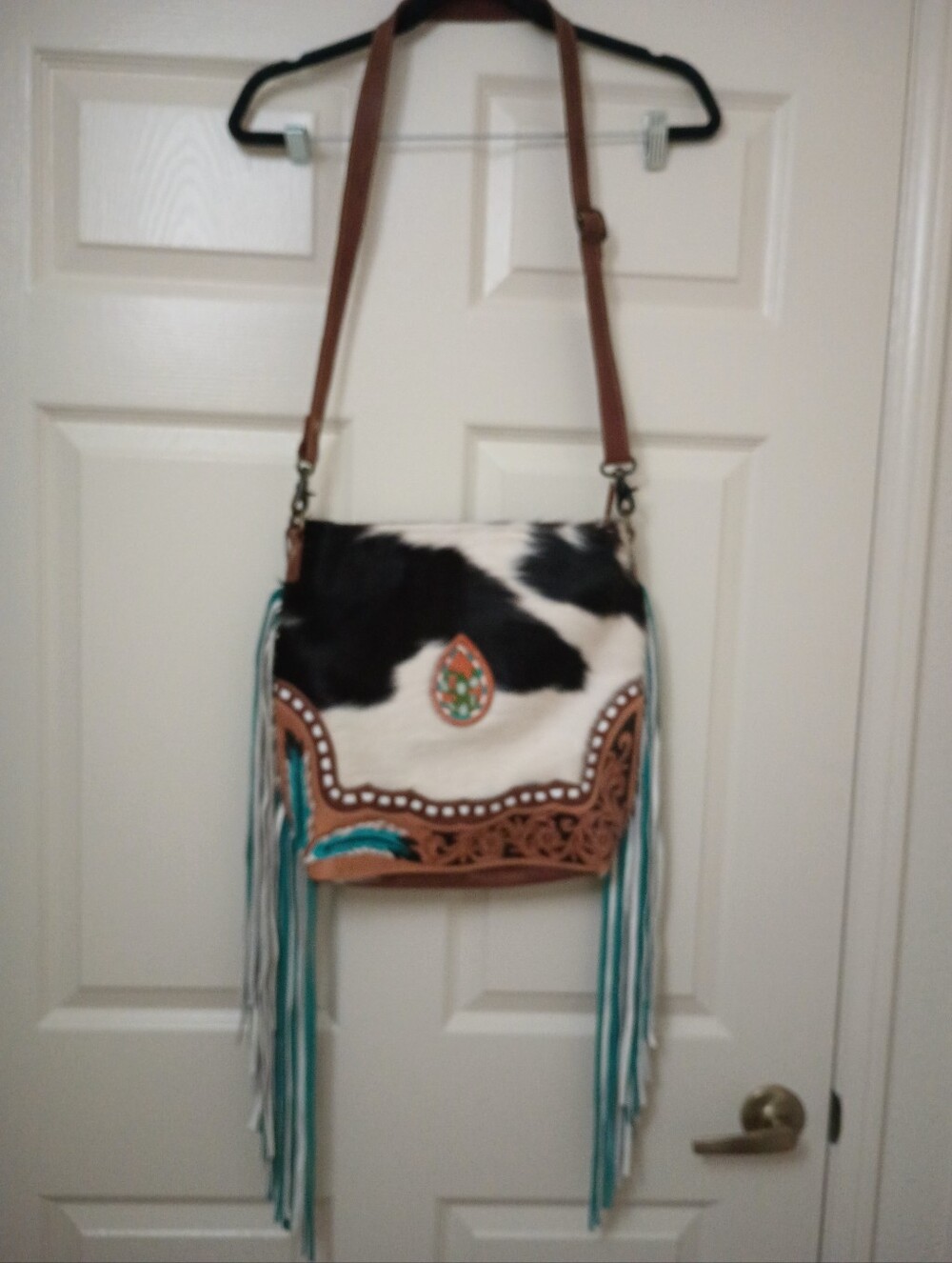 Myra Fringe Crossbody Bag with Cowhide Pattern and Turquoise Accents